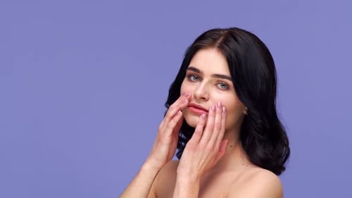 Studio portrait of young and beautiful brunette woman.