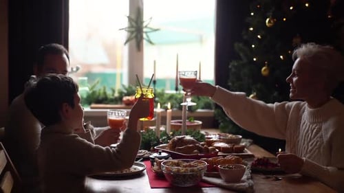 Family Celebrates Holiday Meal Together at Home