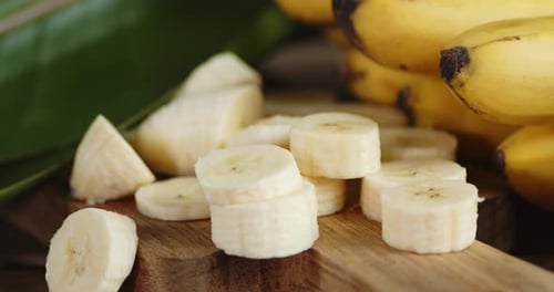 Sliced Bananas on a Wooden Board