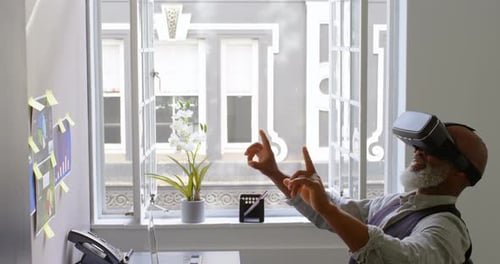 Man Interacting with Virtual Reality Headset in Office