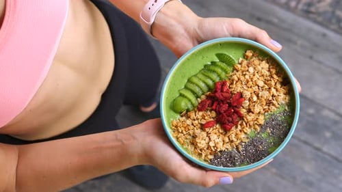 Concept Of Diet, Proper Nutrition And Health. Sport Woman Holding Smoothie Bowl