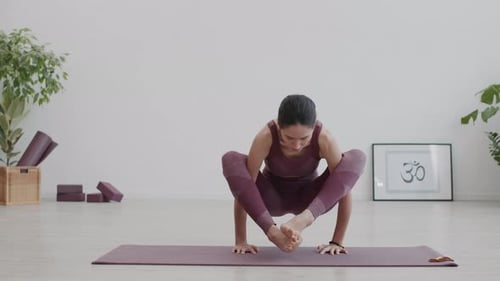 Woman Does Yoga Handstand Balance in Bright Room