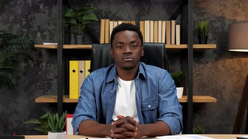 Young Adult Speaking to Camera in Office Environment