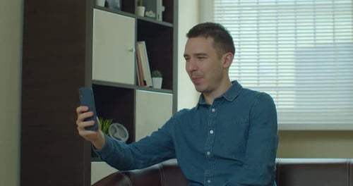 Business Man Having Video Call on Smartphone in Slow Motion. Close Up Guy Making Video Chat Online