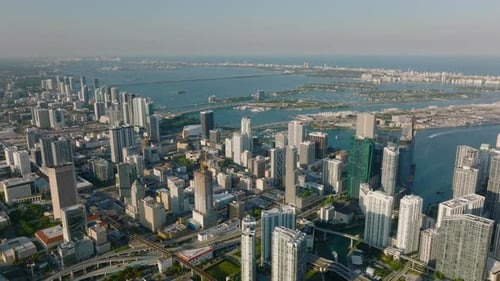 Amazing Aerial Footage of Modern High Rise Buildings in City Lit By Late Afternoon Sun