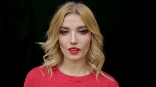 Blonde Woman Wearing Vibrant Makeup