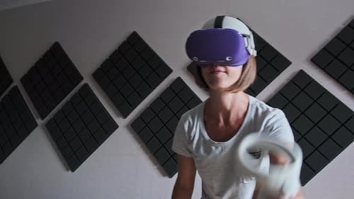 Woman Plays Virtual Reality Game at Home