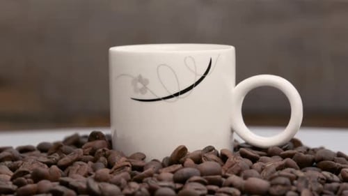 Steaming Coffee Mug Surrounded by Roasted Beans
