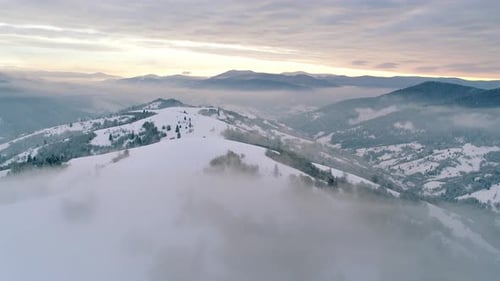 Aerial View in Foggy Sunset Winter Mountain