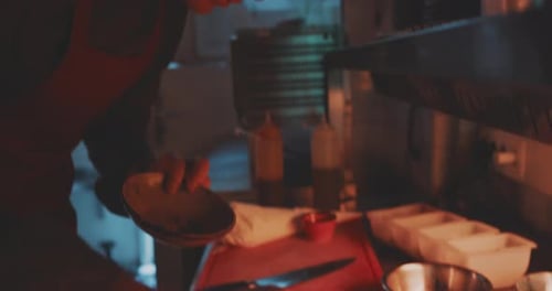 Close up of the chef doing final adjustment on the plate