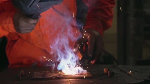 Metal Welder Working with Arc Welding Machine