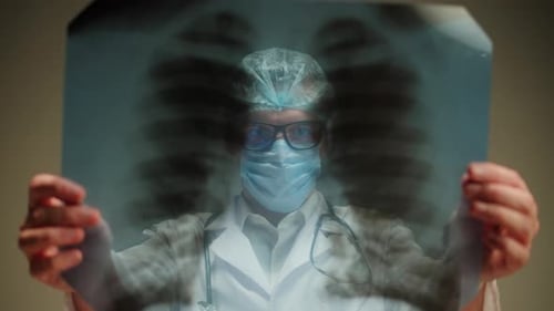 Doctor Examines an X-Ray in Hospital Setting