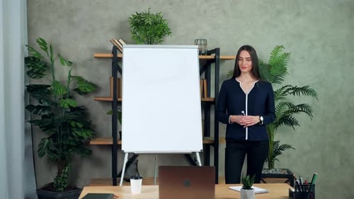 Businesswoman coach greets talk listen teaches students online video call laptop