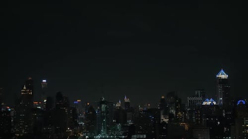 Flash of lightning over night city