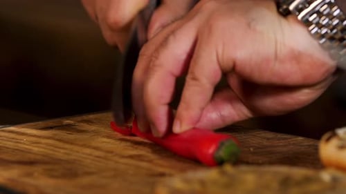 Slicing Red Chili Pepper on Cutting Board