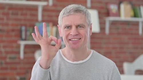 Smiling Man Gives OK Hand Gesture