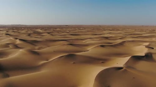 Endless Desert with Massive Sand Dunes Stretching to the Horizon