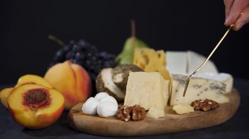 Delicious Cheese Platter with Fruit and Nuts