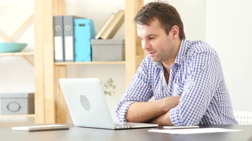 Thumbs Up By Man Sitting in Office