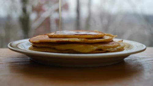 Pancakes Stacked with Delicious Syrup Close Up