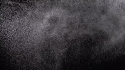 Abstract White Particles Flowing on Black Background