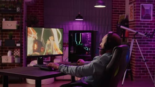 Man playing an Intense Video Game at Night