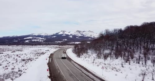 Deep Winter Rural Country Landscape Flying Over Along Deserted Road
