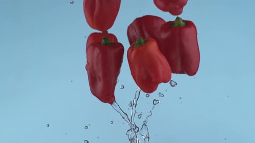 Red peppers flying in slow motion, shot with Phantom Flex 4K at 1000 frames per second
