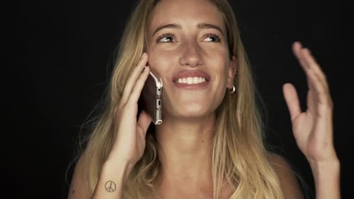 Woman Talking on Cell Phone with Happy Expression