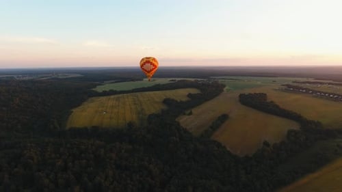 Hot Air Balloon in the Sky Over a Field