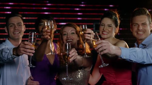 Smiling Friends Celebrate with Champagne at Nightclub