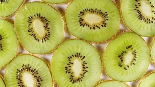 Slow Motion Kiwi Fruit Slices Rotating