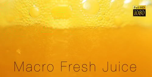 Macro shot of amber soda being poured