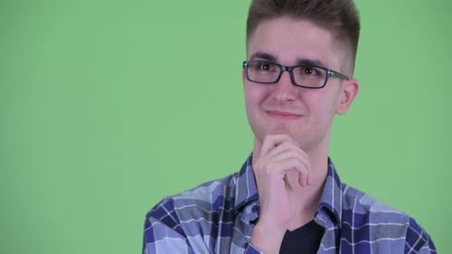 Face of Happy Young Hipster Man Thinking and Looking Up