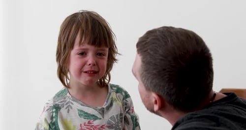 Upset Child Crying with Father