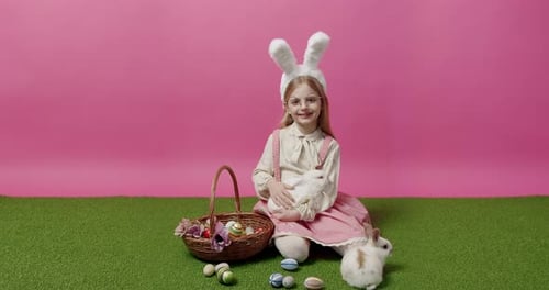 Child with Easter Basket Holding a Fluffy Rabbit