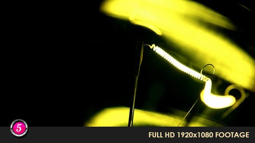 Illuminated Light Bulb Filament Close Up