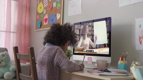 African School Kid Girl Distance Learning with Online Teacher at Home