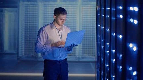 IT Professional Working in Dark Server Room