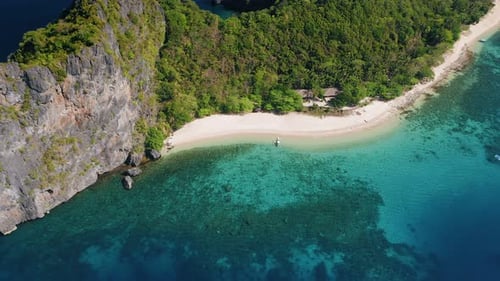 Aerial Circle Fly Over Tropical Beach on Dilumacad or Helicopter Island