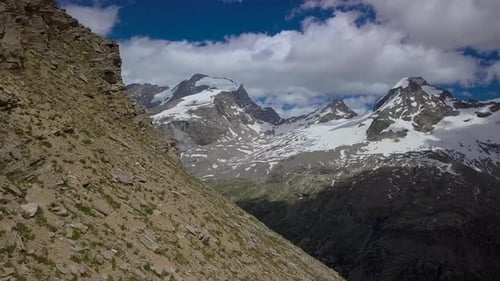 Aerial Flight Through Clouds Over Mountain Landscape