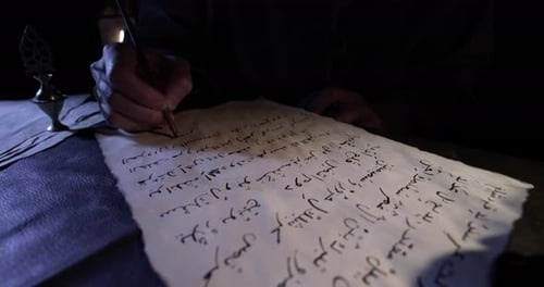 Writing on Parchment with Quill at Night