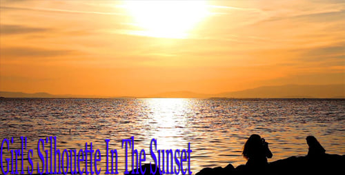 Girl's Silhouette In The Sunset