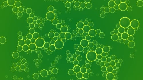 Oil green drops moving in water