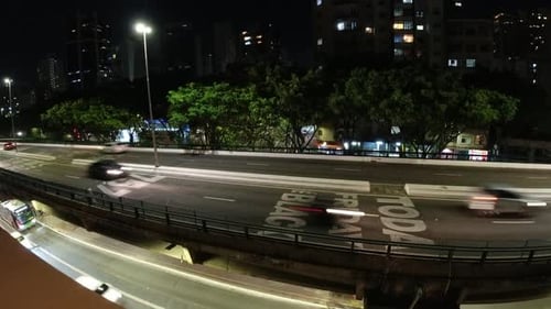 Night timelapse city at downtown district. 4K time lapse city traffic.