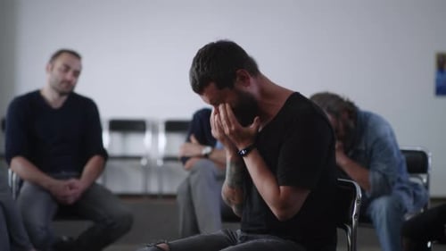 Man Cries During Group Therapy Session