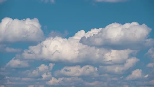Time Lapse Footage of Fast Moving White Puffy Cumulus Clouds on Blue Clear Sky