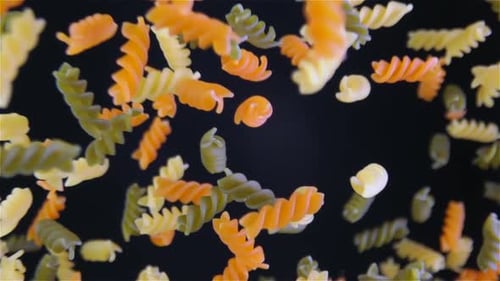 Tri-Color Rotini Pasta Floating in Slow Motion