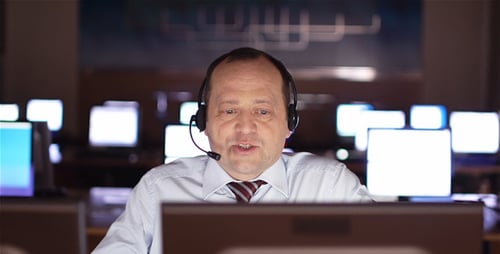 Man Wearing Headset Works in Tech Office