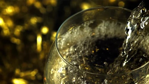 Beverage Being Poured Into Glass With Bubbles
